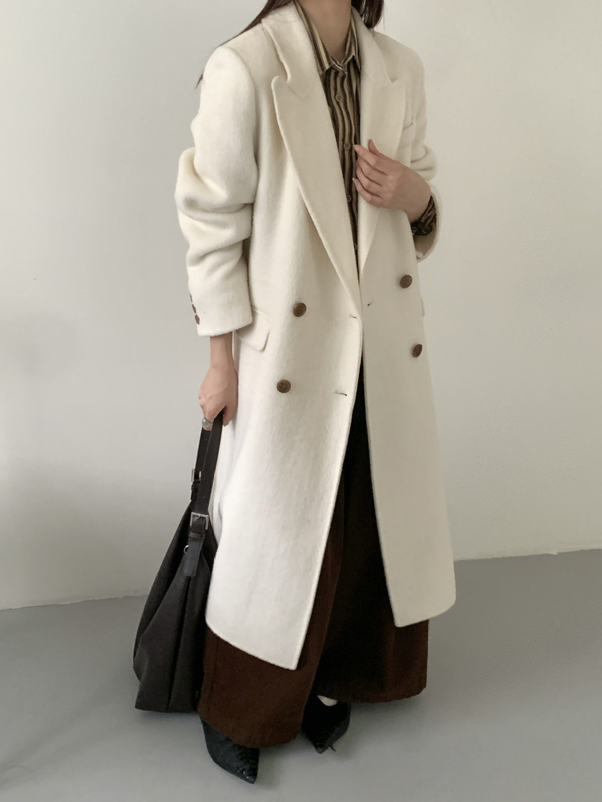 Off-white long double-breasted cashmere coat with high collar and gold-tone buttons