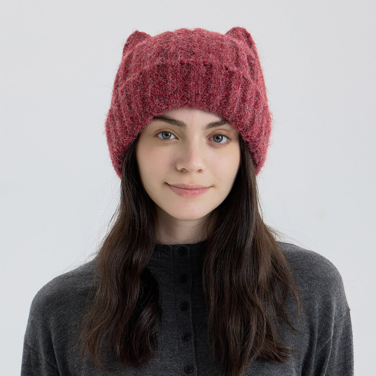 Red-burgundy cat-ear knit beanie with thick fuzzy texture and ribbed cuff