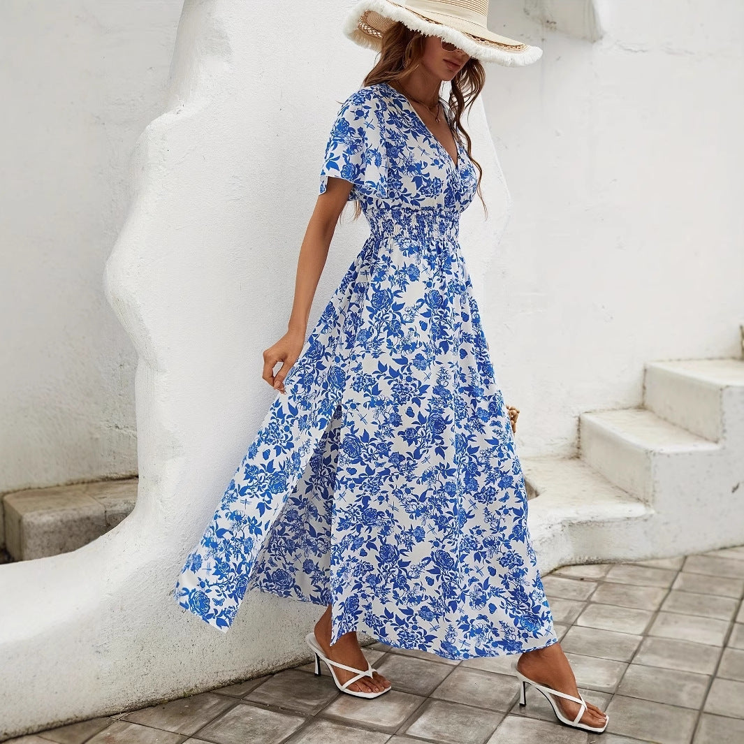 Blue floral V-neck maxi dress with flutter sleeves, smocked waist, front slit