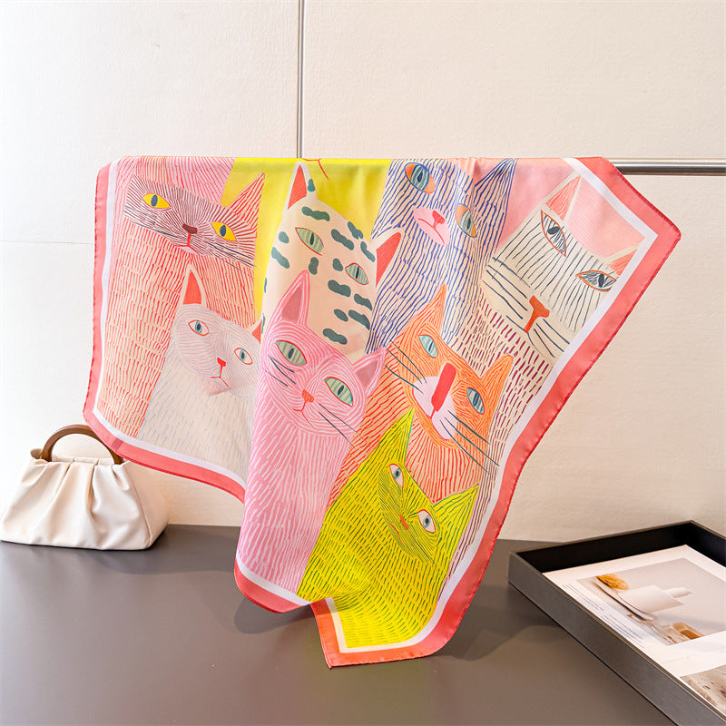 Cat-print silk-look square scarf with coral-pink border and multicolor cat faces