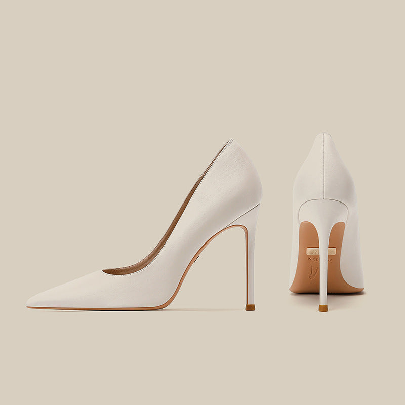 Women's white pointed-toe stiletto high heels, side and rear view
