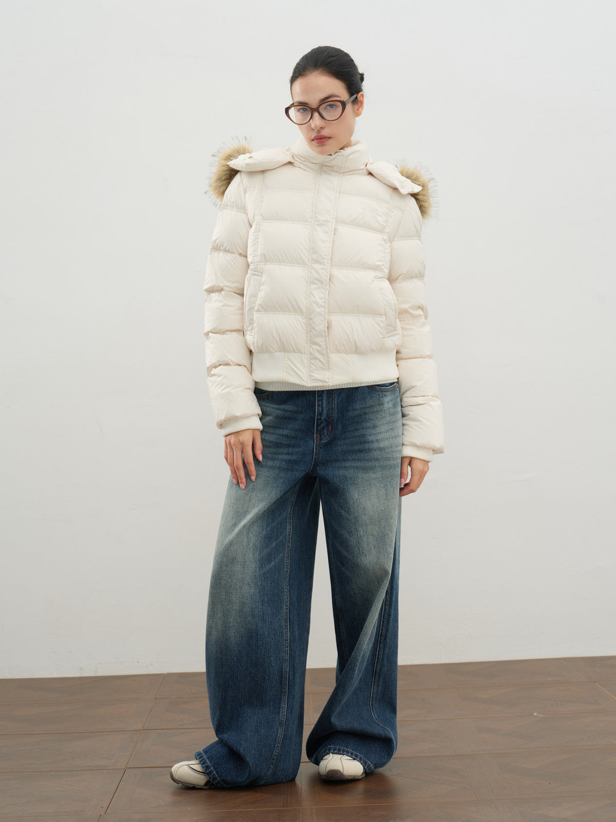 Women's white hooded puffer jacket with faux-fur trim, zip front, quilted sleeves