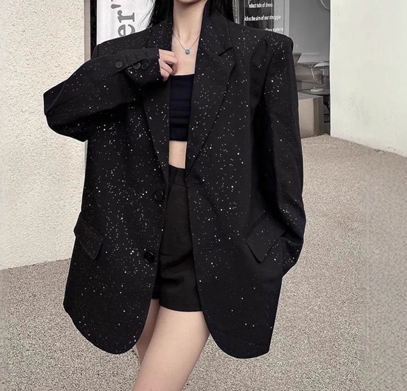 Black sequin tailored blazer with buttoned pockets and structured shoulders