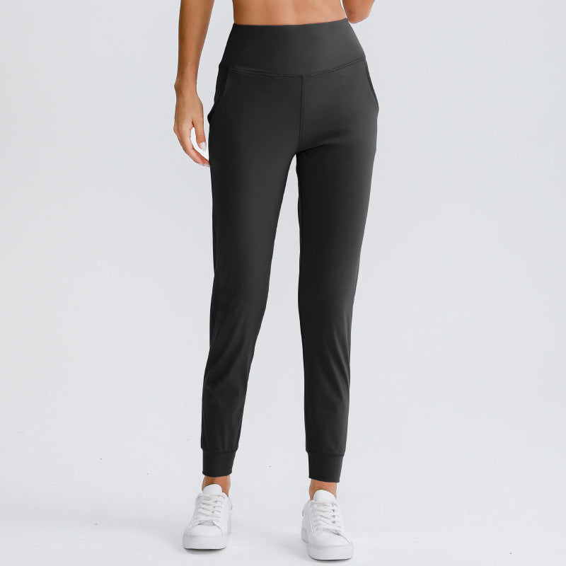 Women's black yoga pants with elastic waistband and ankle cuffs