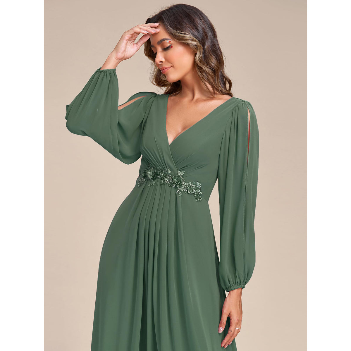 Green V-neck long-sleeve formal dress with cinched waist and flowing pleated A-line skirt
