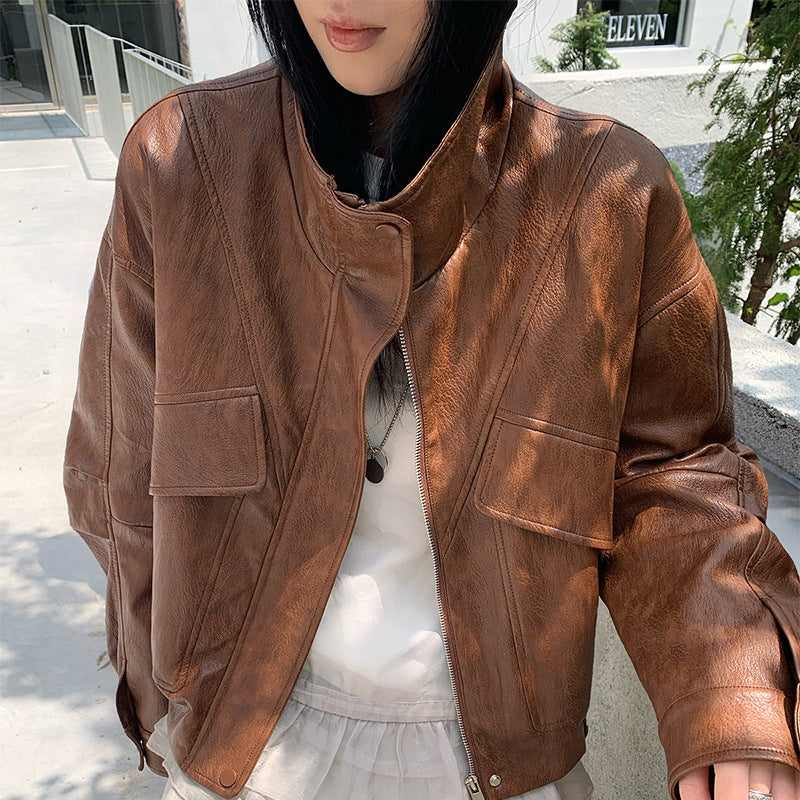 Brown PU leather short jacket with stand collar, zip front, flap pockets