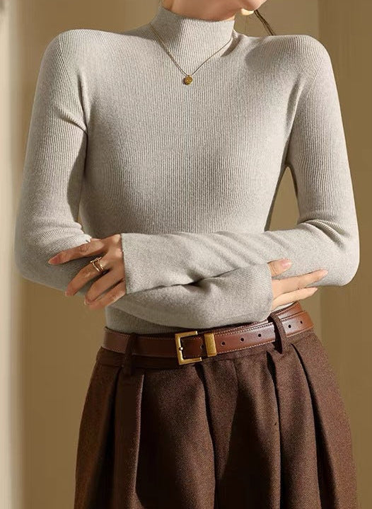 Off-white slim-fit merino wool mock neck sweater with long sleeves and fine ribbed knit