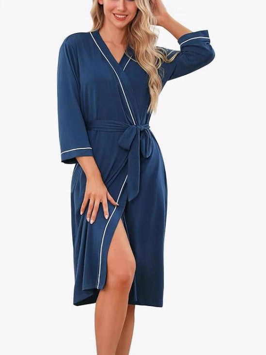 Dark blue kimono robe with V-neck, tie belt, 3/4 sleeves, front slit with light trim