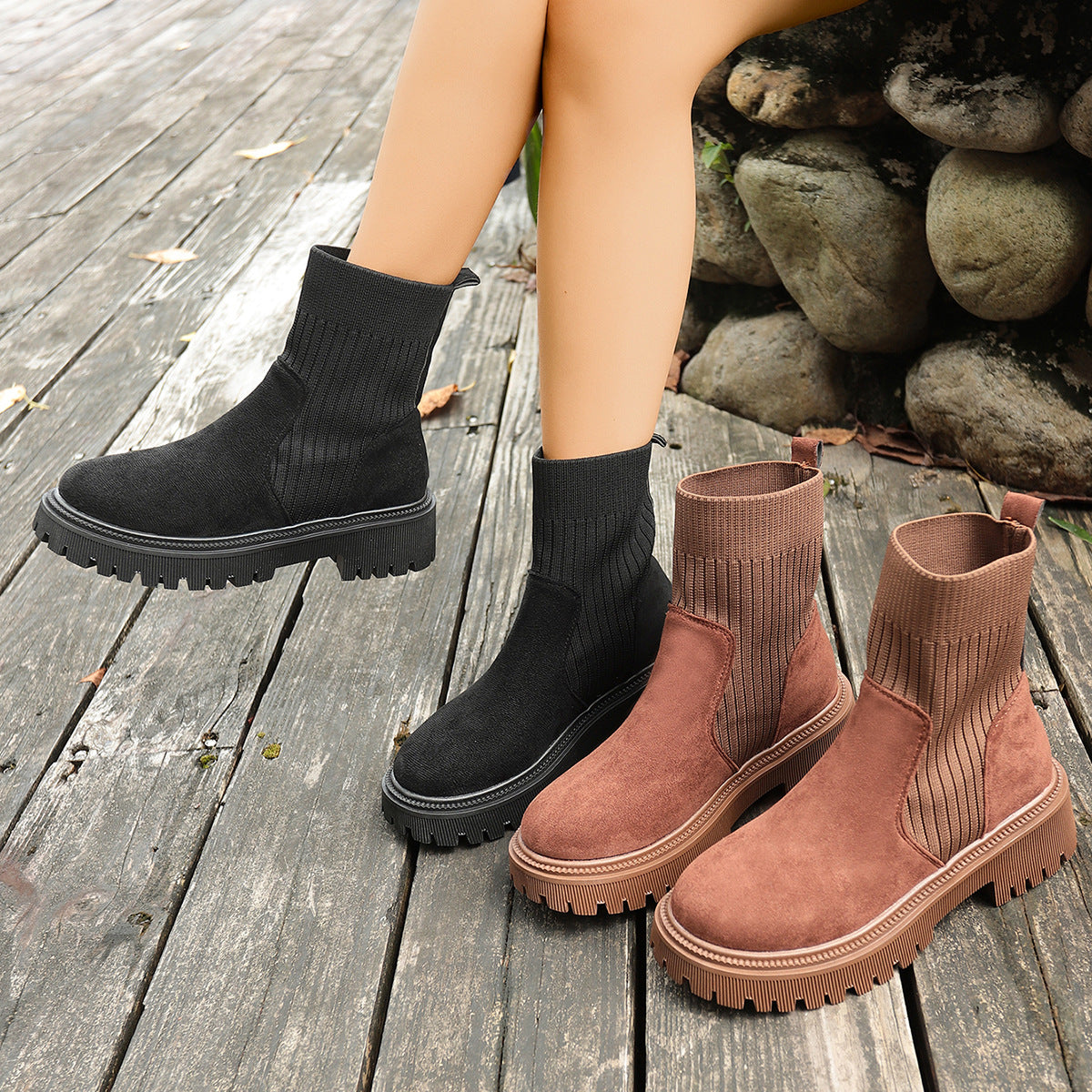 Black knit sock short boots with thick lug sole, pull-on ankle style
