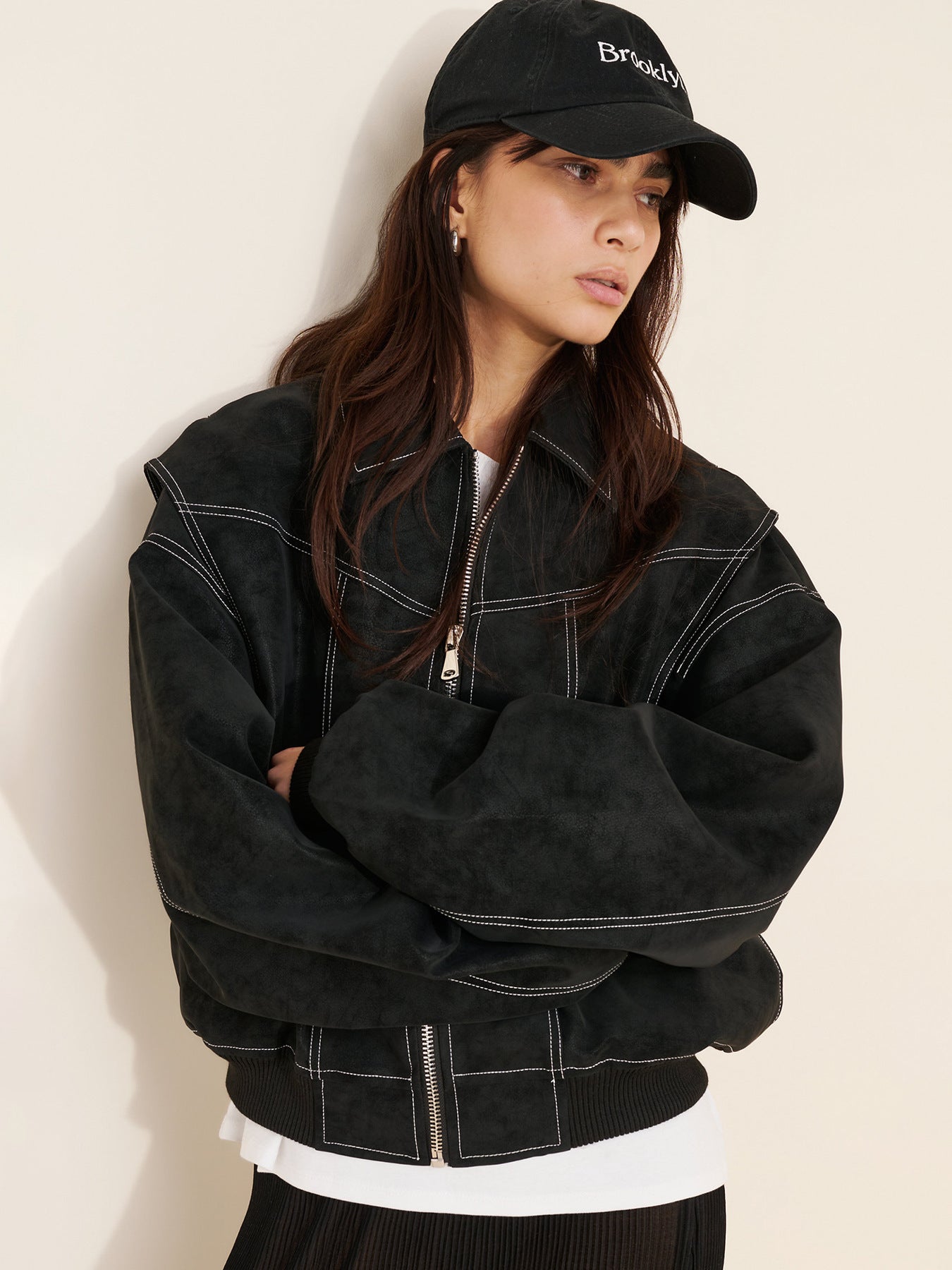 Black faux suede bomber jacket, oversized cropped fit, contrast topstitching, zip front