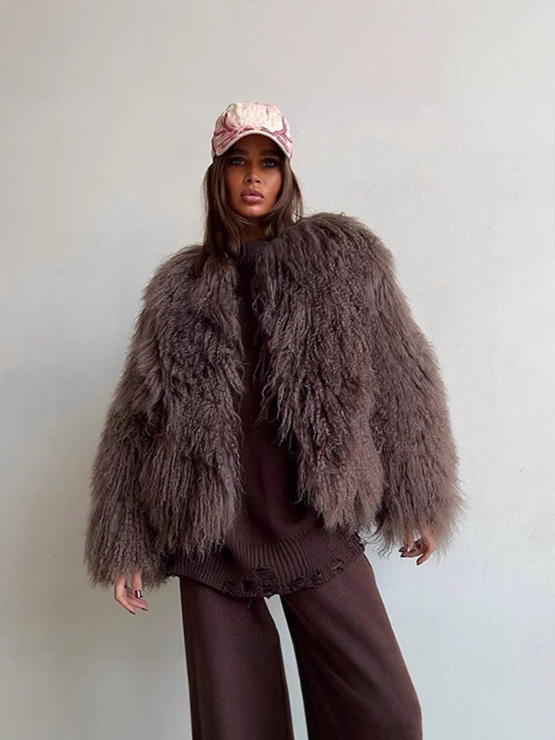 Brown short faux fur coat with long sleeves, shaggy texture, open front