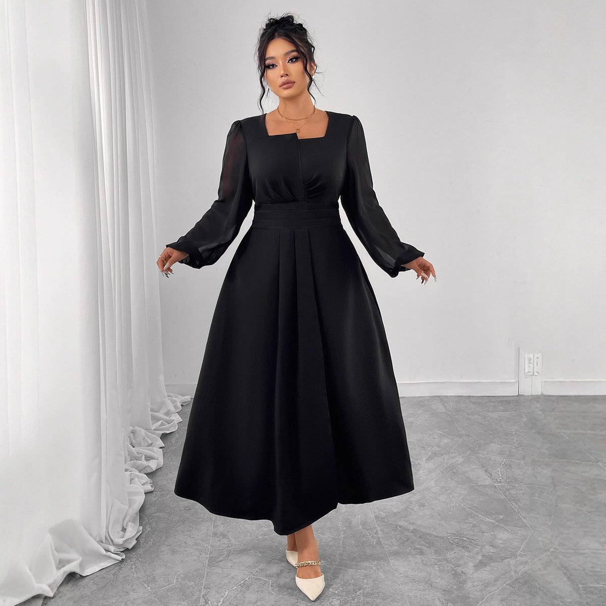 Black long-sleeve midi dress with square neckline and gathered pleats