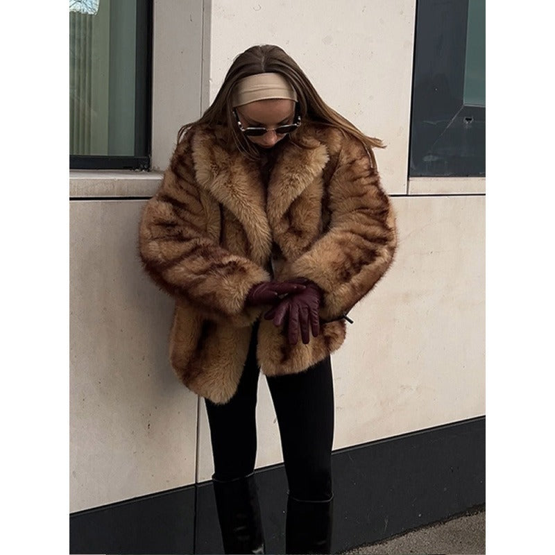 Brown fur jacket with open front and fluffy texture, long sleeves