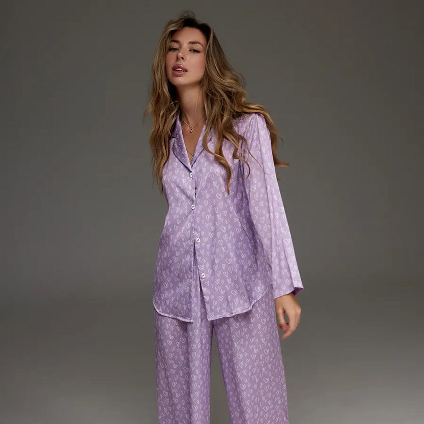 Women's lavender printed pajama top and wide-leg trousers set, long sleeves, button front.