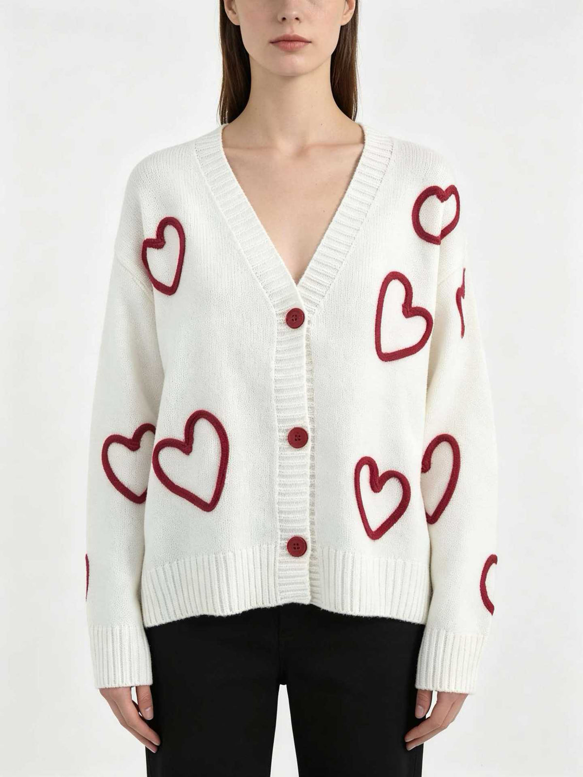 White V-neck knit cardigan, pink heart designs, button front