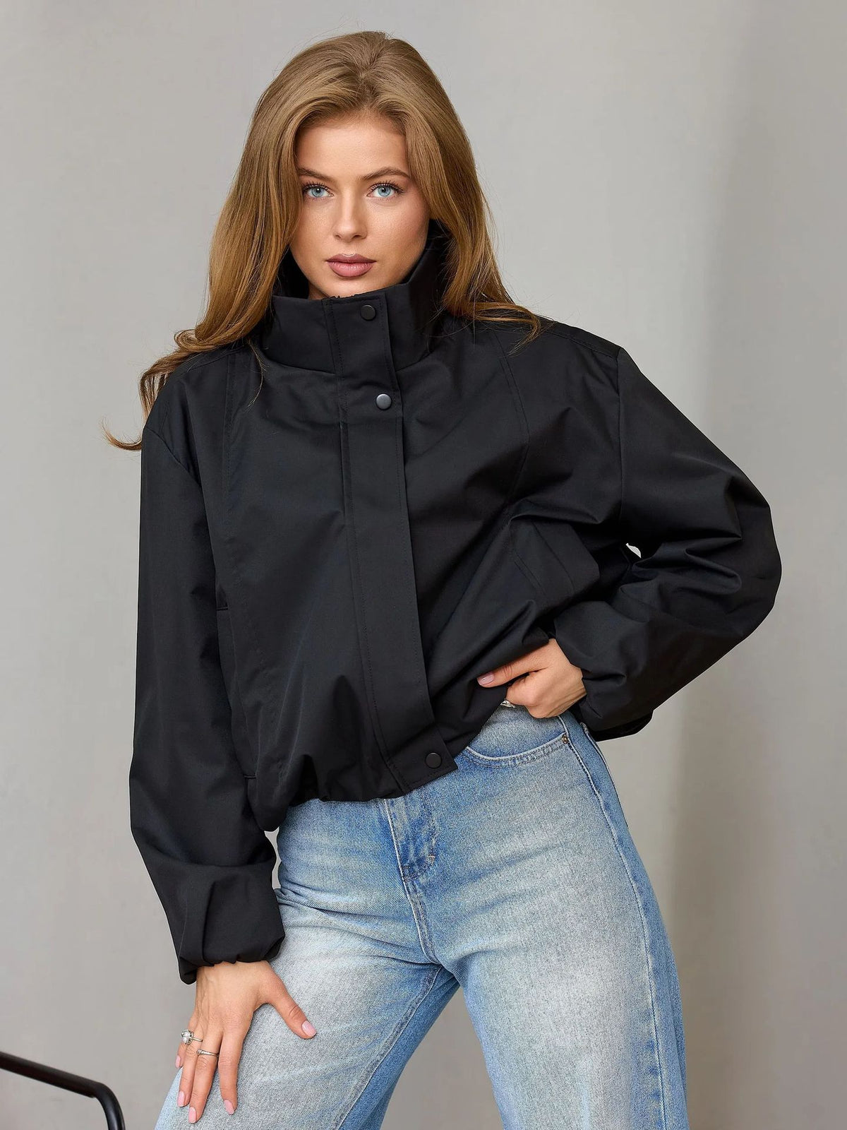 Black women’s short casual jacket with stand collar and button front