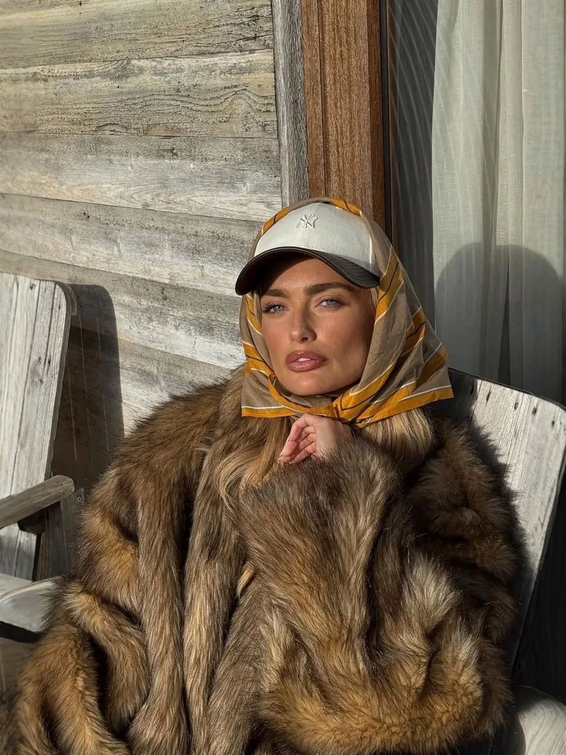 Women’s brown faux fur short coat with high collar and thick shaggy pile