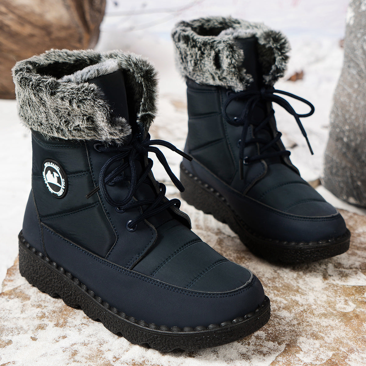 Dark blue lace-up winter boots with faux-fur lining, laced shaft, and thick sole