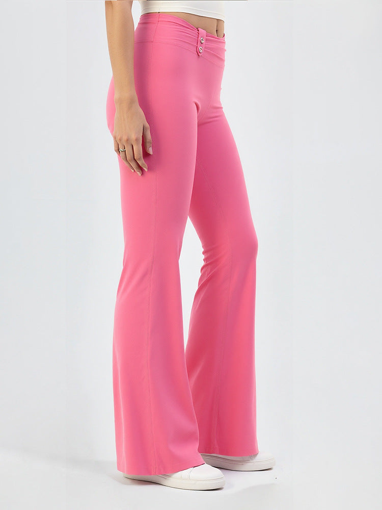 Pink high-waisted yoga flare pants with buttoned waistband, wide flared legs