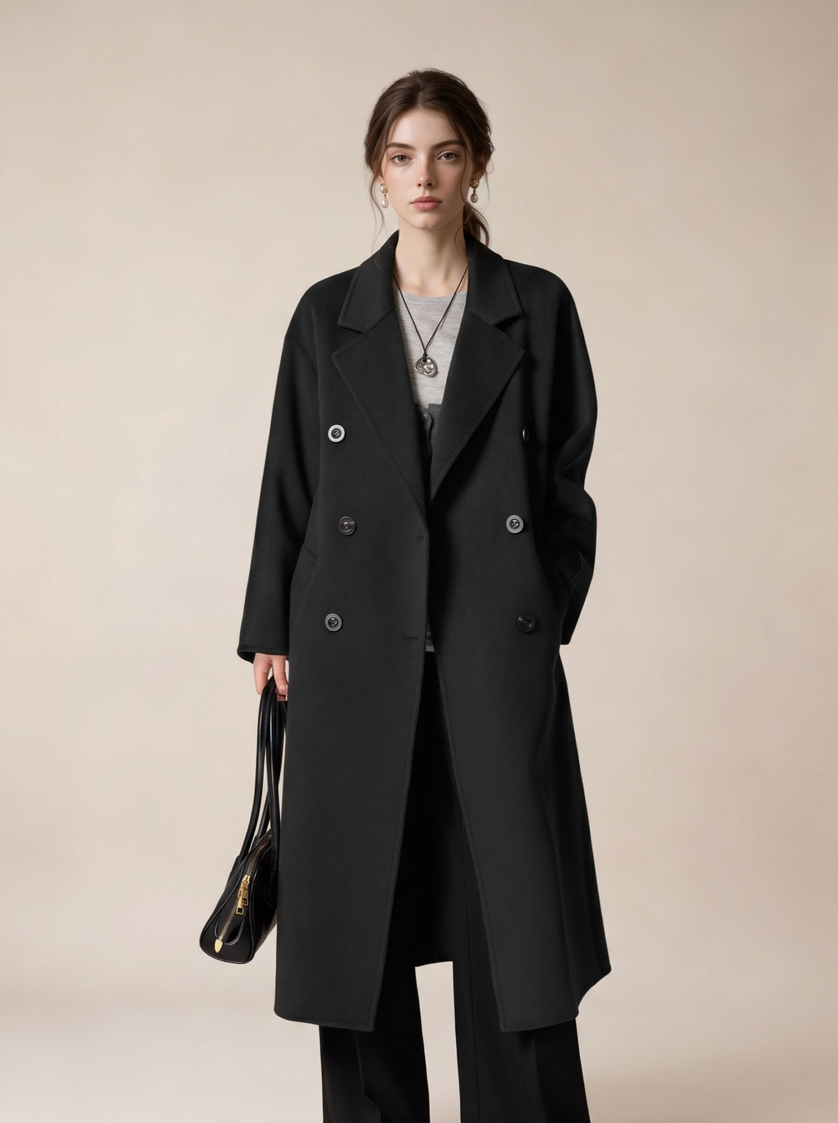 Long black double-breasted wool coat with wide lapels and button front