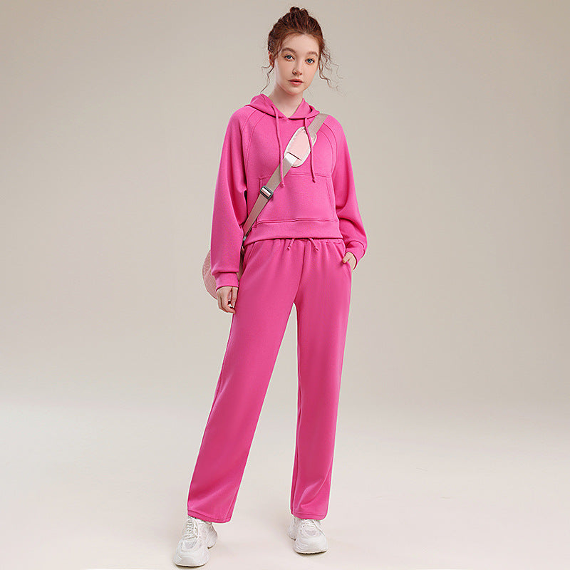 Pink hooded tracksuit set with relaxed jogger pants, long sleeves and cuffed cuffs