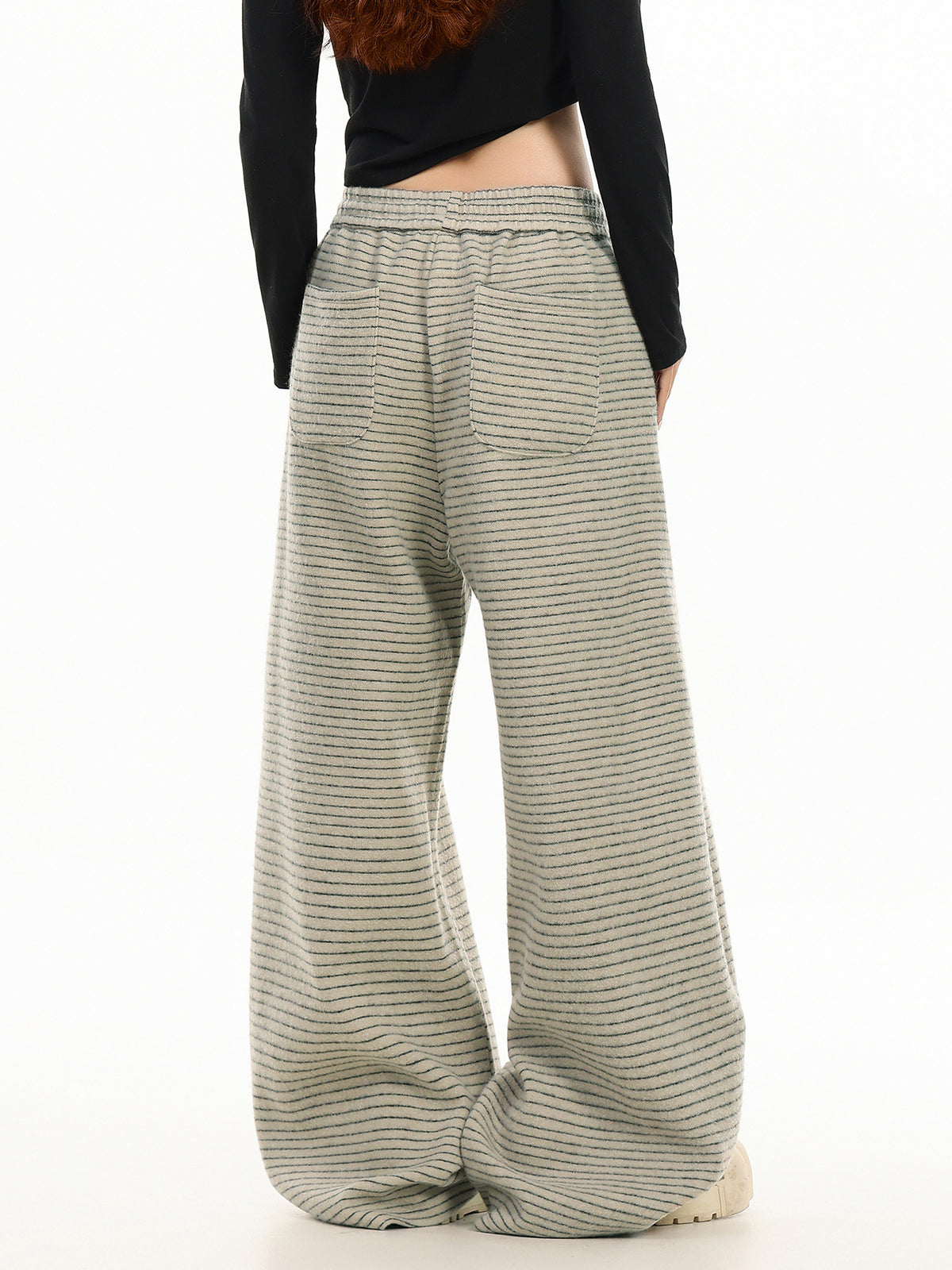 Beige striped wide-leg sweatpants with drawstring waistband and relaxed fit