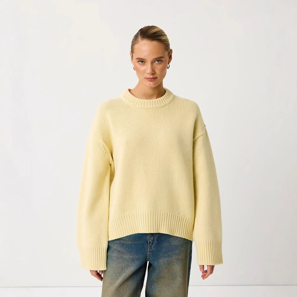Women's light yellow round-neck knit pullover sweater with ribbed cuffs and hem