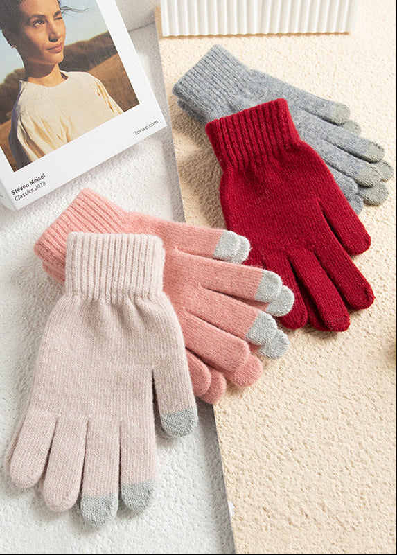 Set of knit winter gloves in pink, light gray, and wine red, with full fingers
