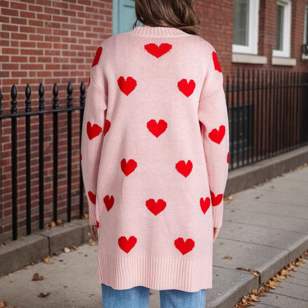 Pink knit cardigan with red hearts, back view, open front, long sleeves, mid-length