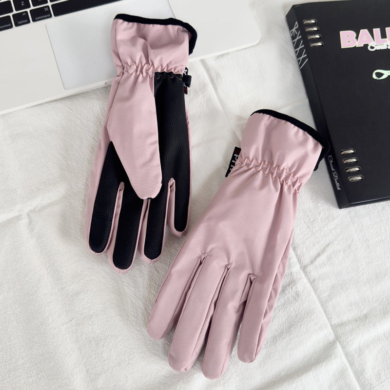 Pink full-finger winter gloves with black textured fingertips and padded knuckles
