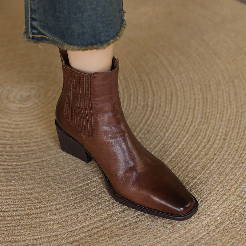 Brown leather Chelsea boots with square toe and thick block heel, front side view