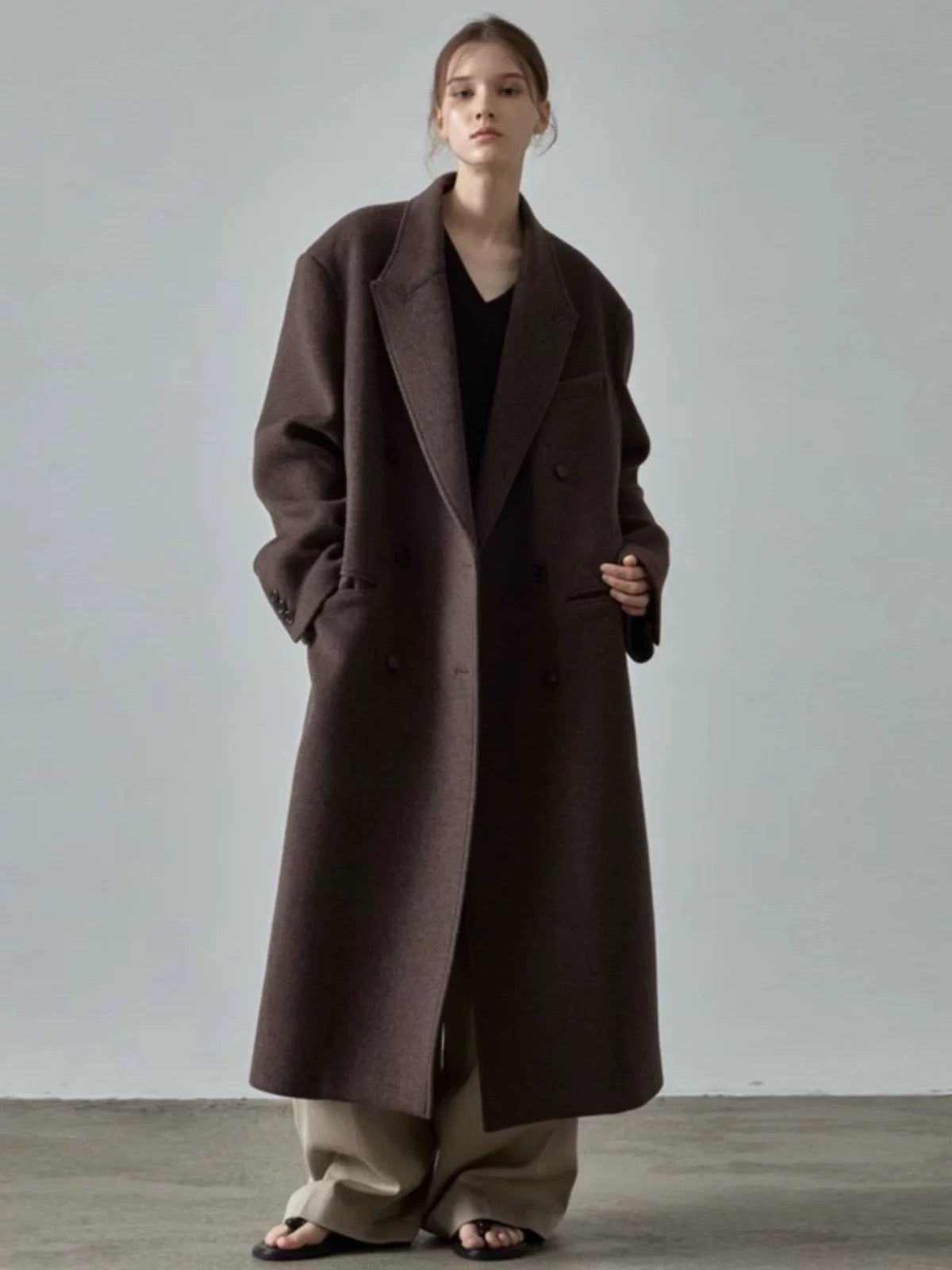 Brown long wool coat, double-breasted design with wide lapels and long sleeves