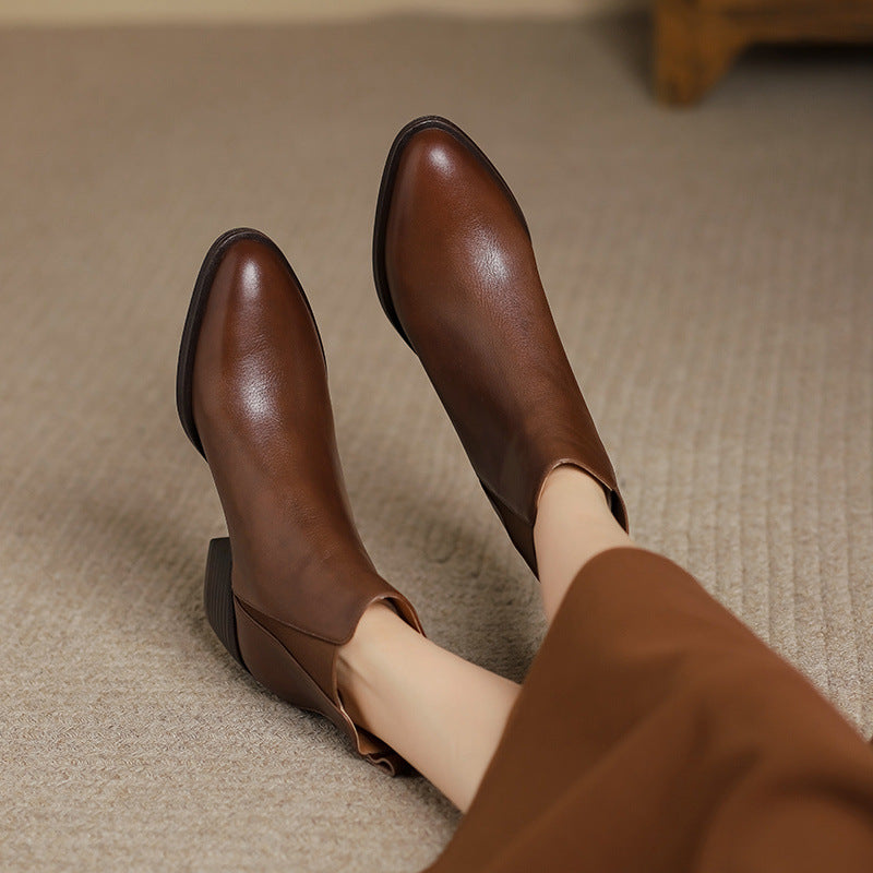 Brown leather Chelsea boots with pointed toe and side elastic panels