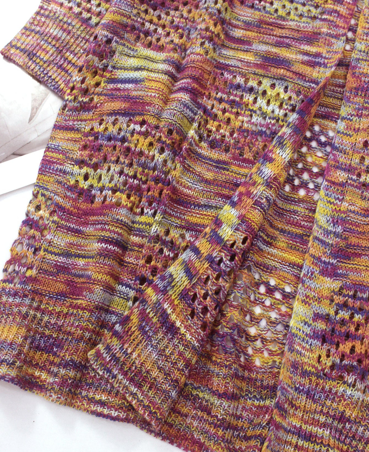 Women’s multicolor knit cardigan sweater with gathered front and textured placket