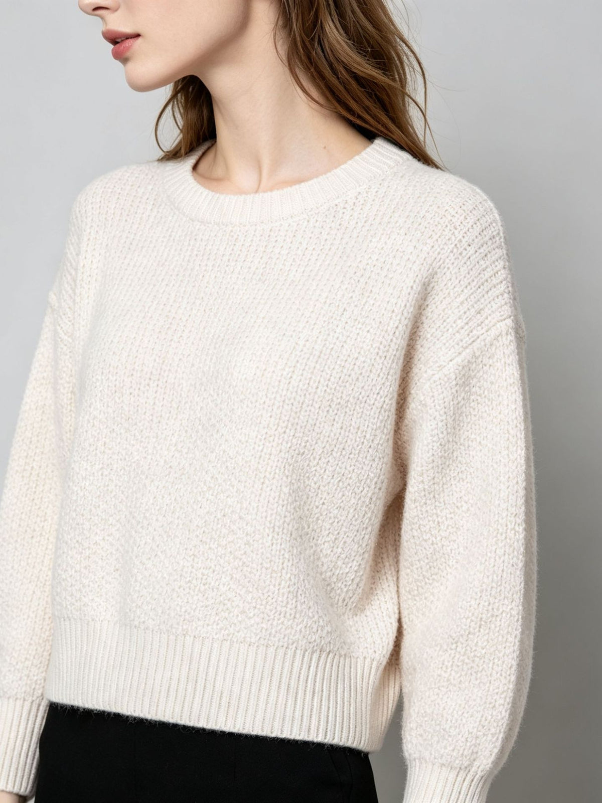 White knit pullover sweater with crew round neck, long sleeves, ribbed cuffs and hem