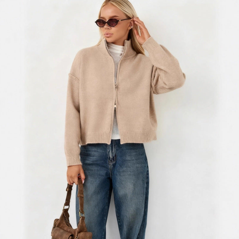 Women’s oversized zip-up cardigan sweater, beige funnel neck, full-zip front.
