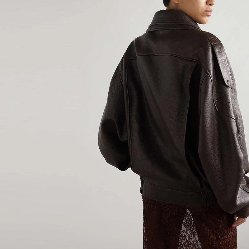 Black leather motorcycle jacket back view with dropped shoulders and ribbed cuffs