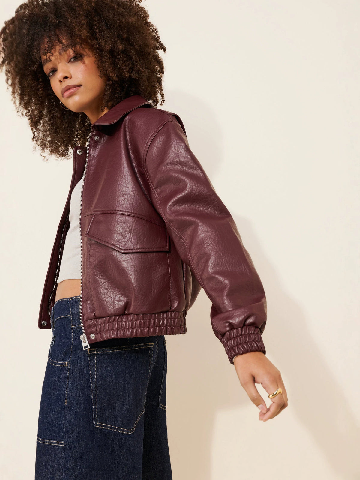 Burgundy faux leather bomber jacket with lapel collar, zip front, chest and side pockets