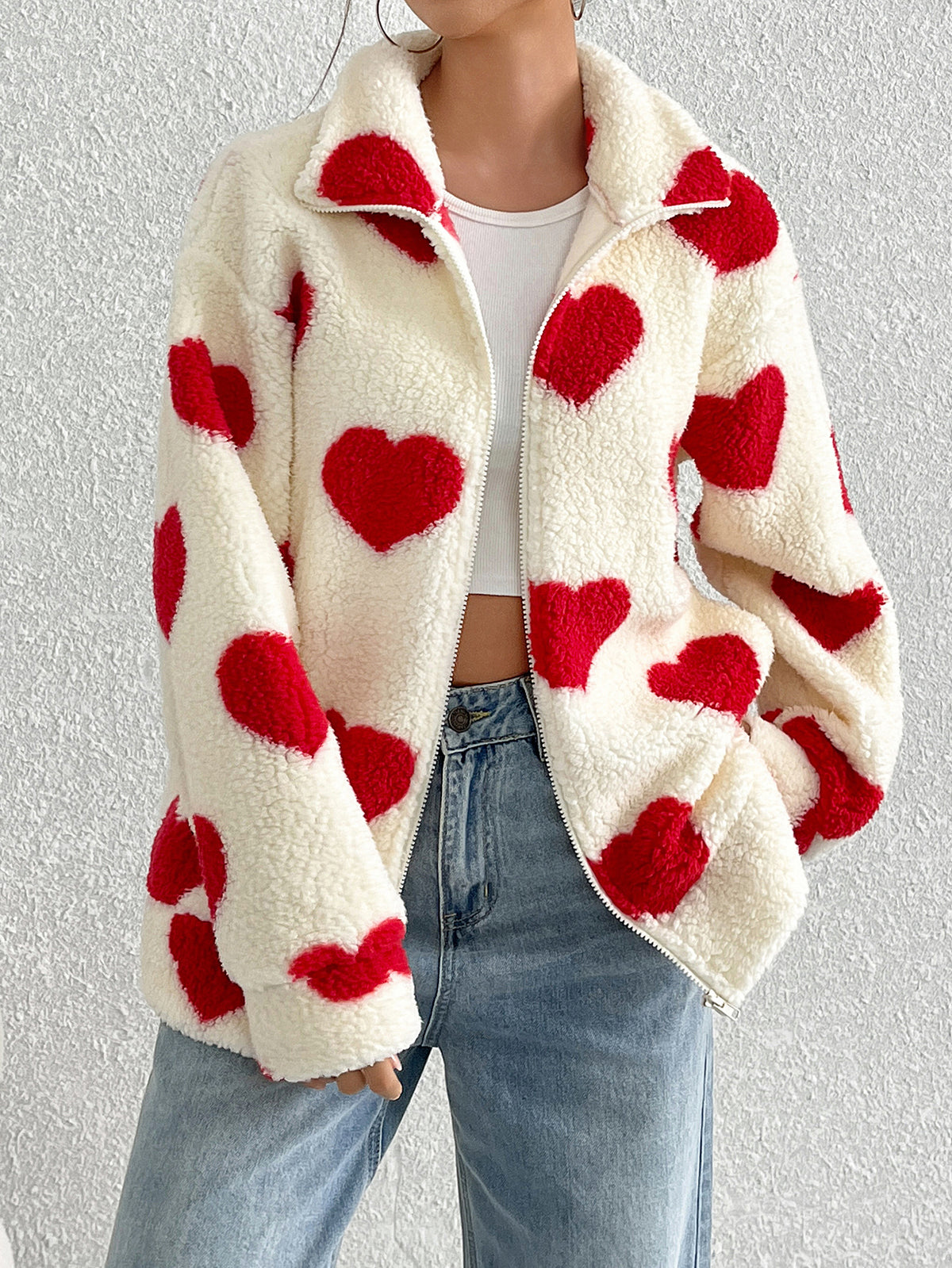 Cream plush zip-up cardigan with red heart pattern, long sleeves, sherpa-style collar
