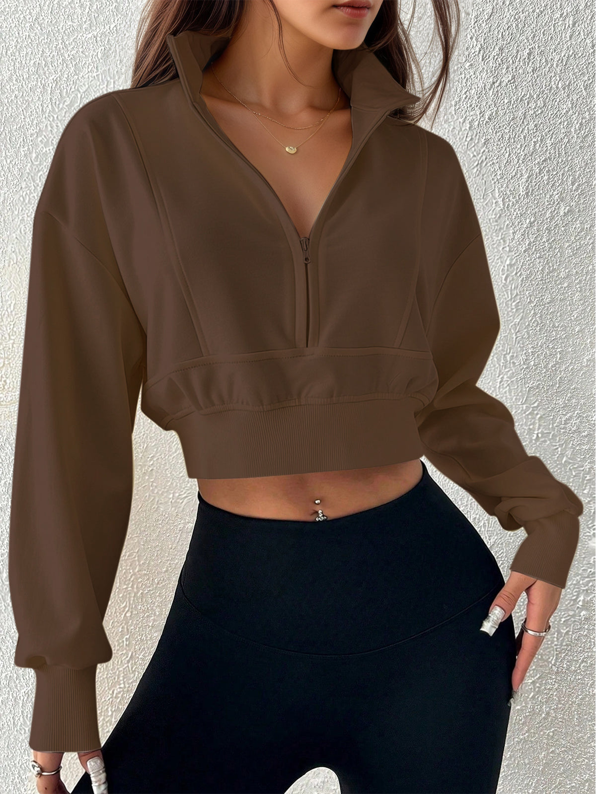 Dark brown zip-neck cropped sweatshirt with stand collar, long sleeves; loose fit