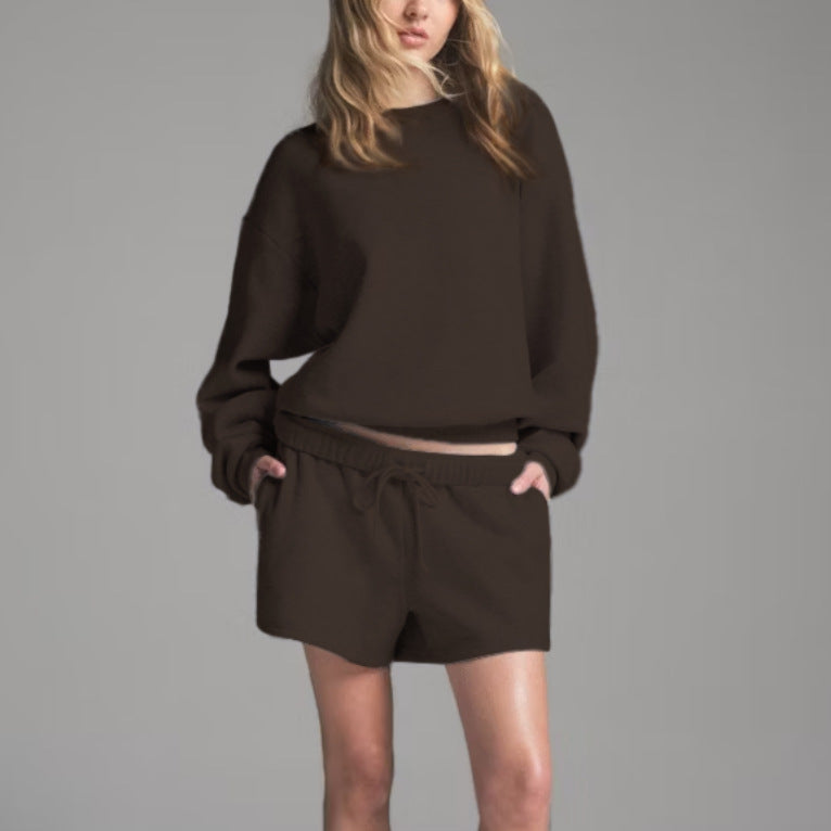 Women’s dark brown sweatshirt and shorts set with round neck long sleeves and drawstring waist.