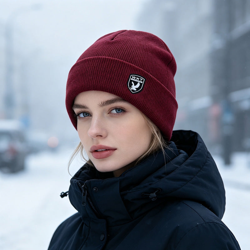 Fleece-lined knit beanie hat, wine red, ribbed cuff with small front logo patch