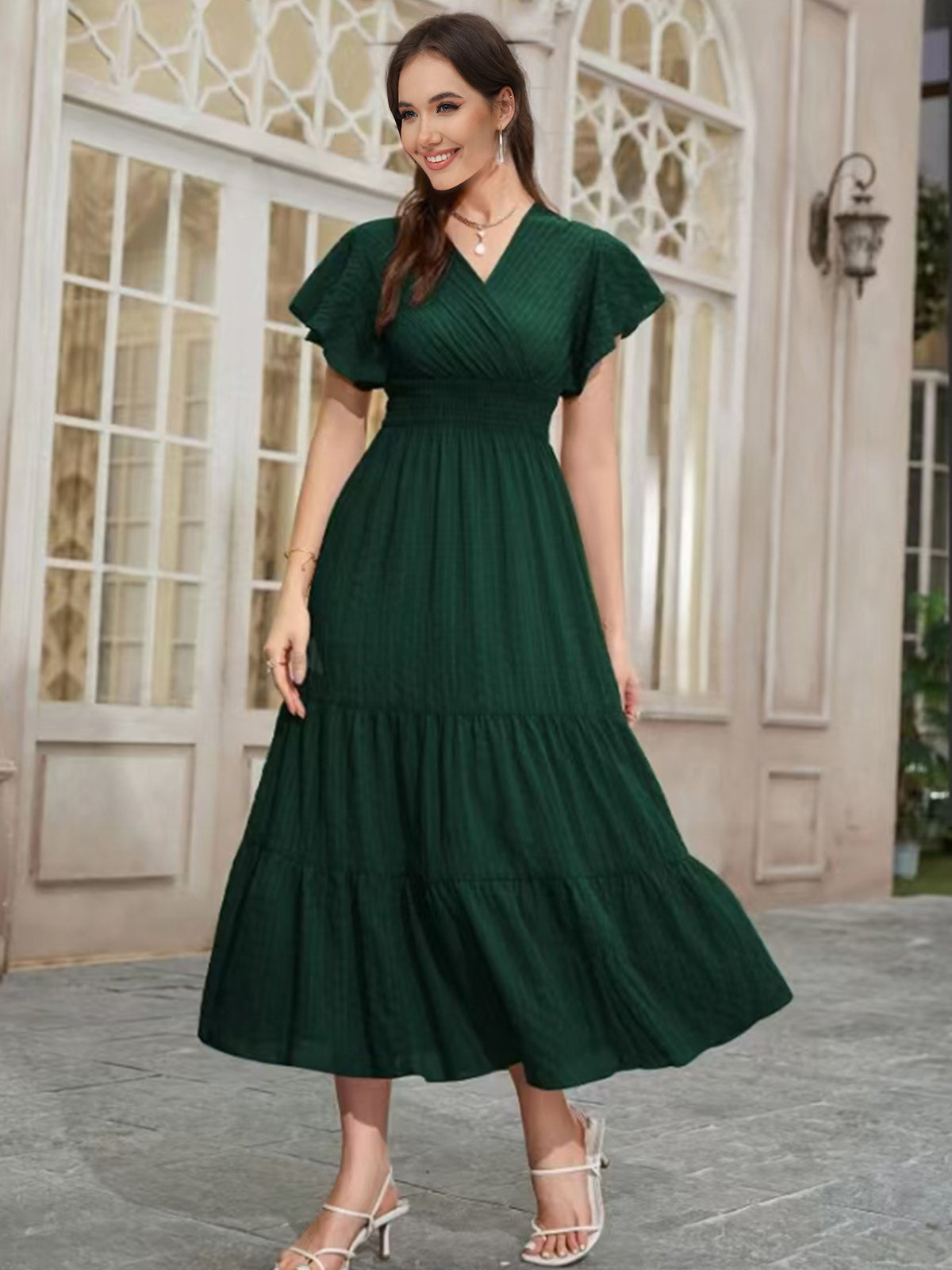 Dark green V-neck tiered midi dress with puff sleeves and smocked waist