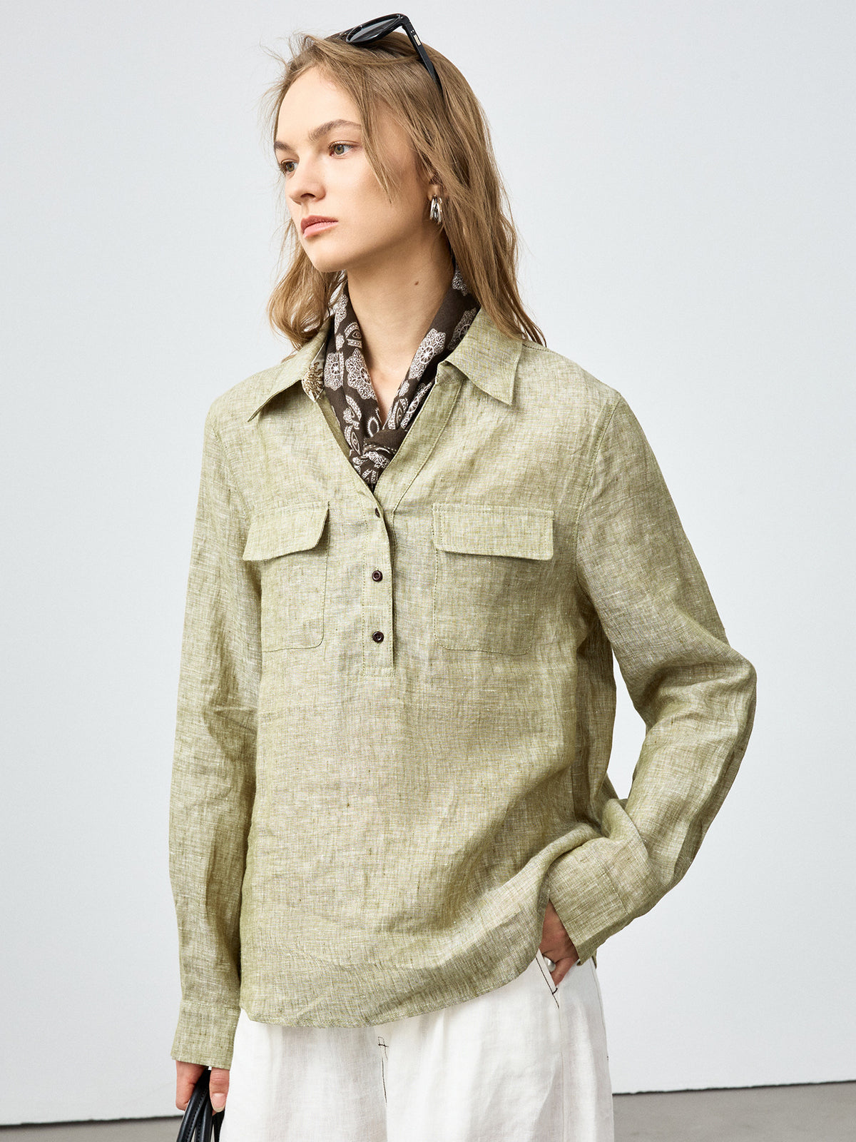 Women’s olive linen button-up shirt with two chest pockets and neck scarf