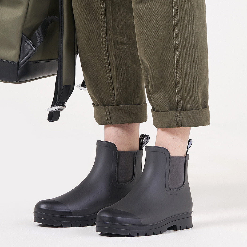Dark gray short rain boots with pull-on side panels and textured traction sole