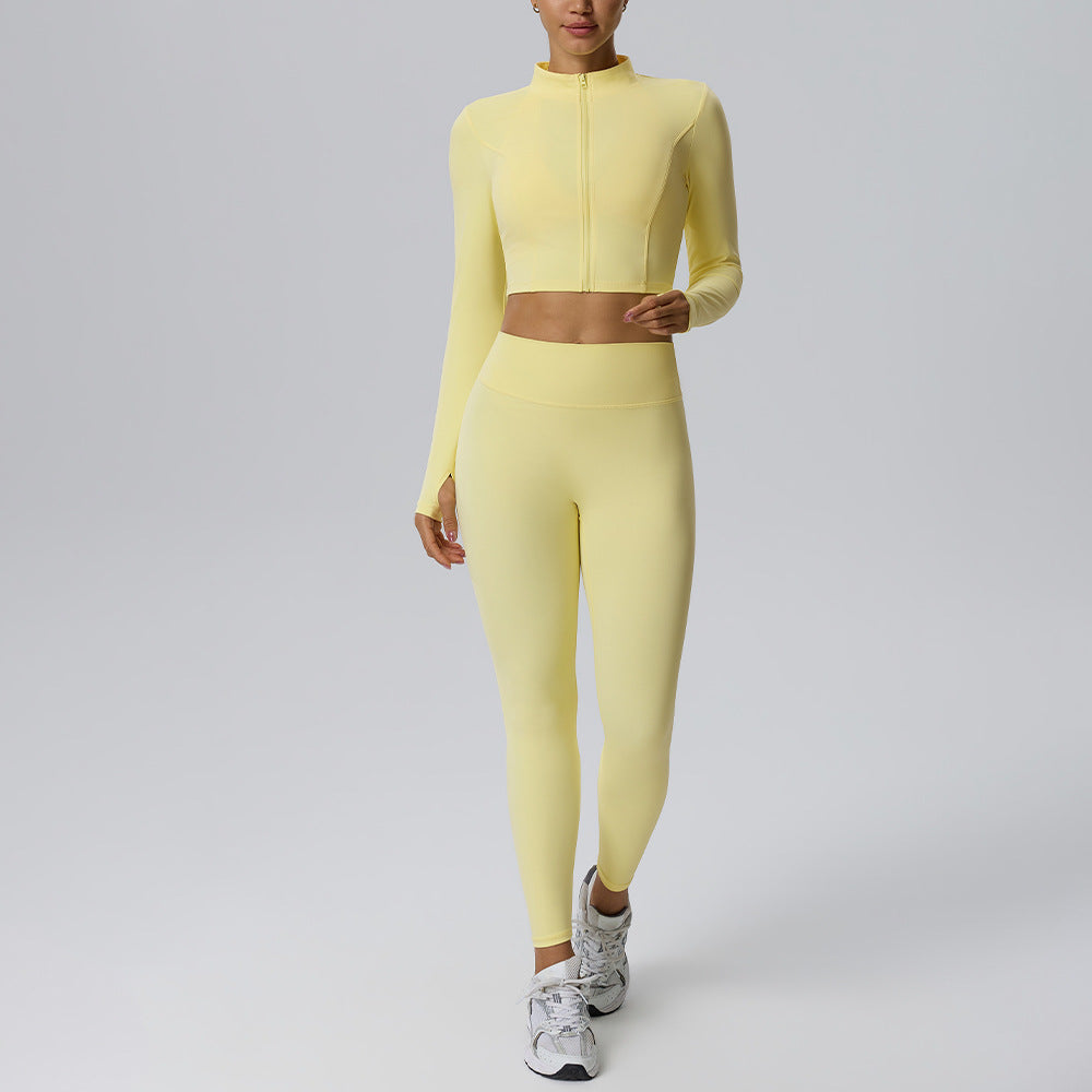 Women's yellow yoga set with zip long-sleeve crop top and fitted high-rise leggings