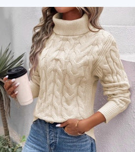 Women's cream cable-knit turtleneck sweater with long sleeves and textured twist pattern