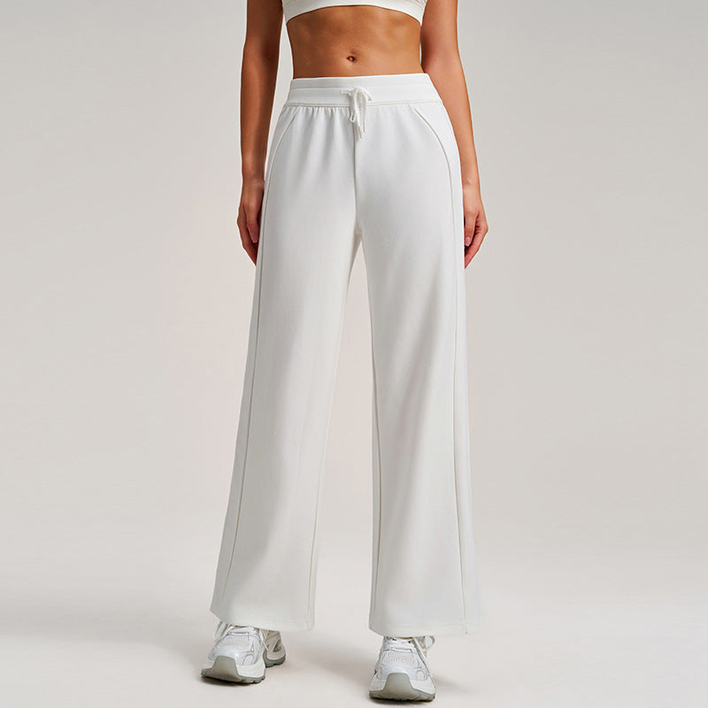 White high-waisted wide-leg drawstring sweatpants with elastic waistband, straight relaxed drape