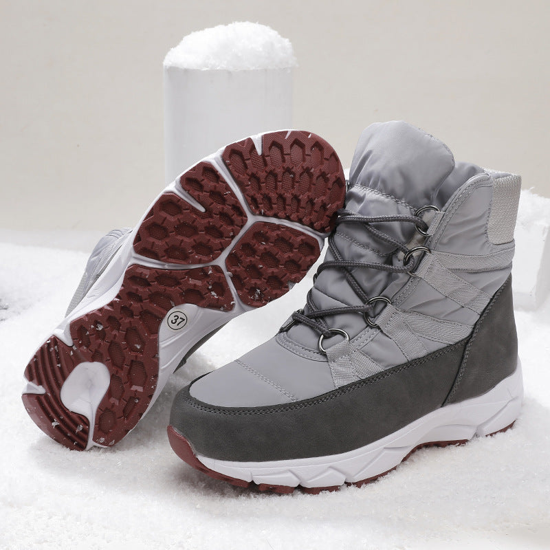 Gray snow boots with lace-up quilted upper; red rubber tread outsole shown