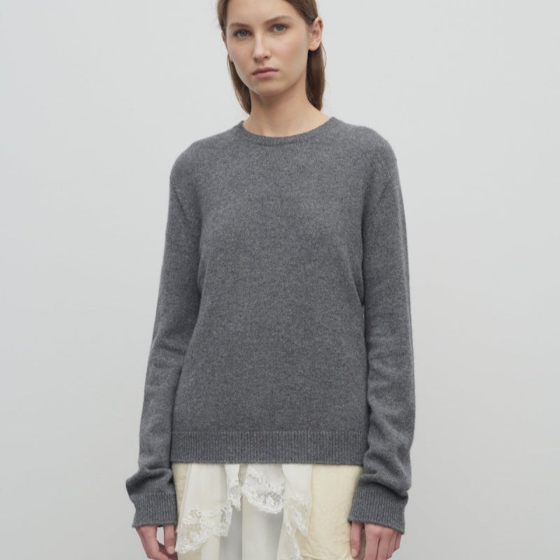 Women's gray knit pullover with long sleeves and crew neckline, relaxed fit